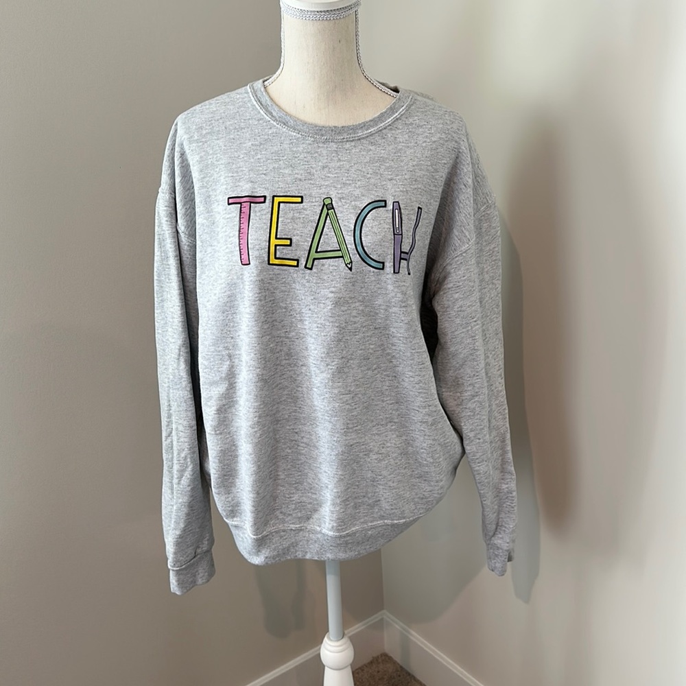Gray Crew Neck Sweater with Colorful 'Teach' Design